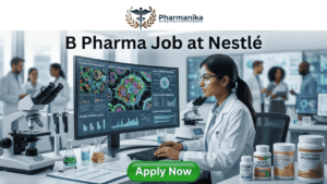 B Pharma Job at Nestlé A professional and vibrant featured image for a job post titled "B Pharma Job at Nestlé." The image depicts a young female scientist of Indian descent wearing a white lab coat and safety glasses, working in a modern, brightly lit laboratory. She is smiling while looking at a large computer monitor that displays complex biological data and molecular visualizations. On her desk are various nutritional products, including bottles labeled "Multi-Vitamin" and "Nutritional Powder," alongside laboratory glassware and scientific documents. The Biotecnika logo is placed at the top center, and a prominent green "APPLY NOW" button is located at the bottom.